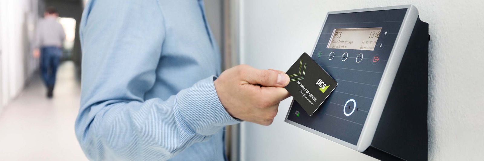 A badge presented to a wall mounted card reader