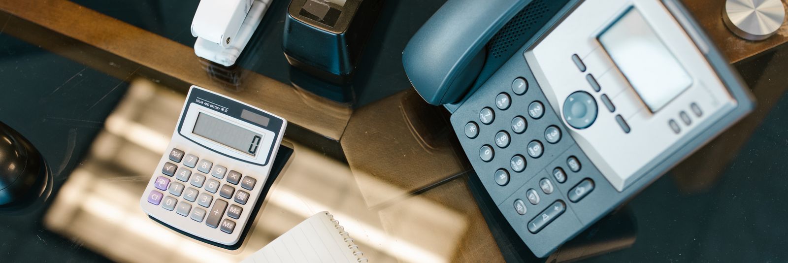 An IP desk telephone on an office desk